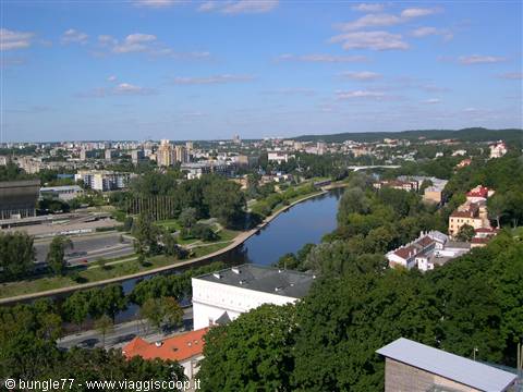 The Neris river flows through Vilnius among trees and red roofs