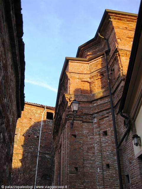 Brick apse of an ancient palace, warm light between old walls