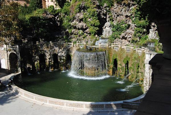 Oval fountain with waterfall and statue in the Tivoli villa