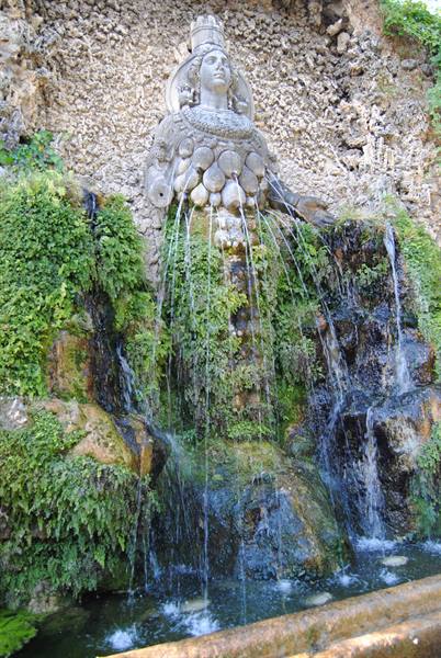 Stone female statue with water jets in the Villa d'Este nymphaeum, Tivoli