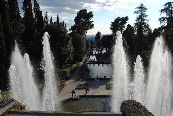 Fountain jets at Villa d'Este among cypress trees and garden paths