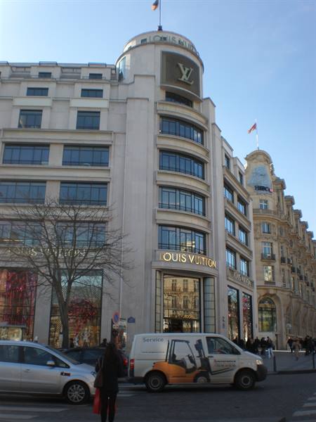 Louis Vuitton store on the Champs-Élysées in Paris, van and pedestrians below