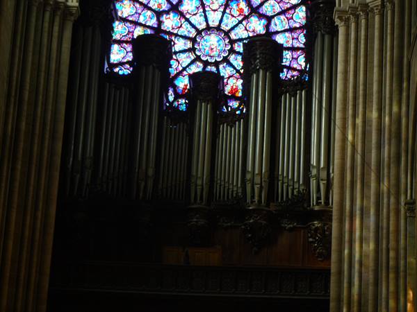 Organ pipes beneath the great rose window of Notre-Dame cathedral, Paris