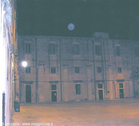 inner courtyard of the ducal palace with full moon in the background
