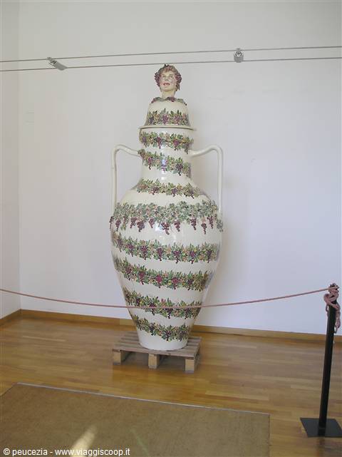 Large ceramic amphora decorated with vines and grapes, museum