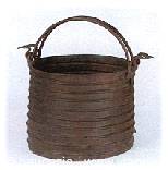 Wooden stave bucket with curved iron handle on white background