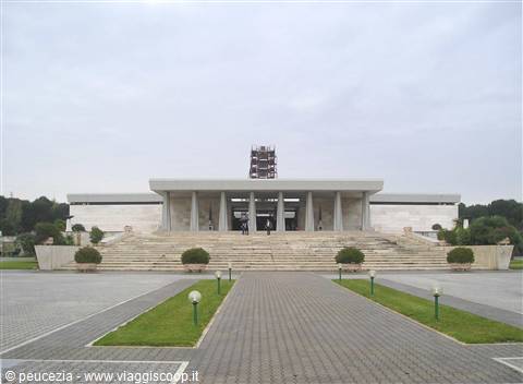 Monumental marble building with columns and wide staircase, glowing spheres on the lawn