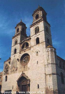 Romanesque stone facade with rose window and twin towers, Bitonto Cathedral
