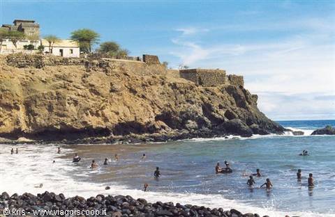 Swimmers on the black pebble beach below São Filipe fortress, Cidade Velha