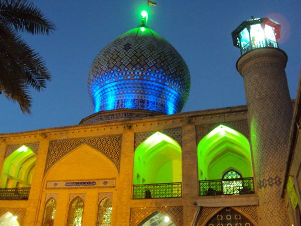 Shah Cheragh shrine in Shiraz, blue tiled dome glowing at night