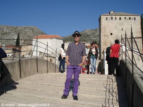 Me on the bridge of Mostar with purple grillin pants