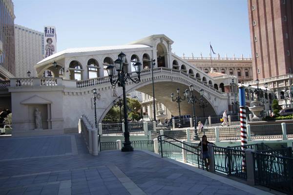 Concrete replica of the Rialto Bridge in Las Vegas, with lampposts and pedestrians