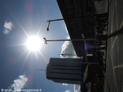 Bright sun over lampposts and the facade of Liverpool Lime Street station