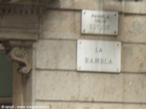 Marble plaque reading La Rambla on a stone wall in Barcelona