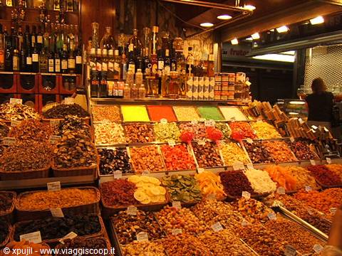 Stalls of dried fruit and sweets at Barcelona's Mercat de la Boqueria
