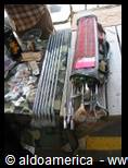 Car radiators and spare parts for sale on an outdoor market stall