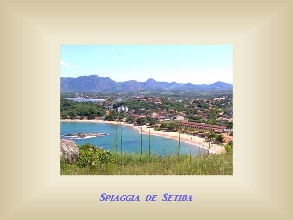 Setiba beach: turquoise water, sandy shore, houses amid greenery