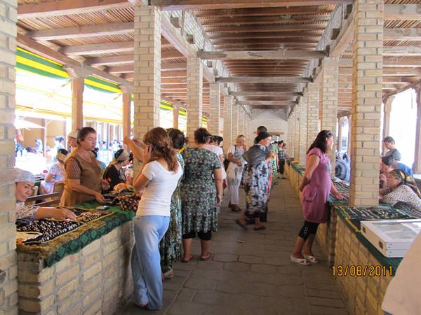 Women selling fabrics under the brick arcade of Chorsu Bazaar, Samarkand