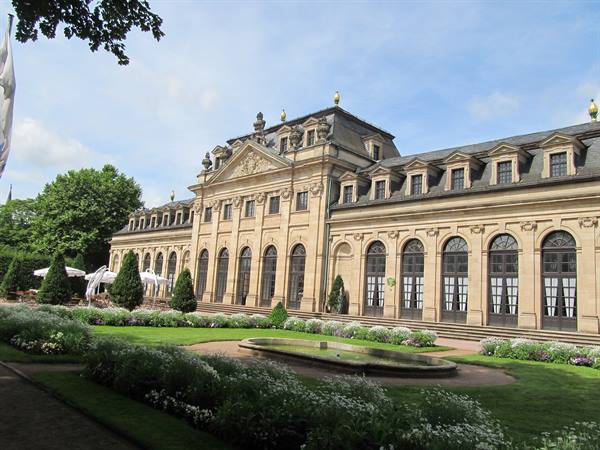 Sandstone orangerie building with garden beds and fountain, Fulda
