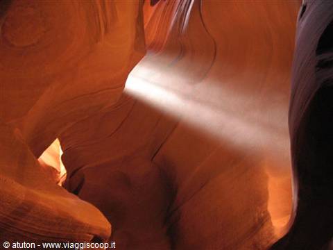 Light beam inside Antelope Canyon, carved orange sandstone walls