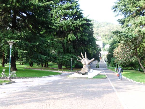 Giant bronze hand in the park lawn near the monumental staircase