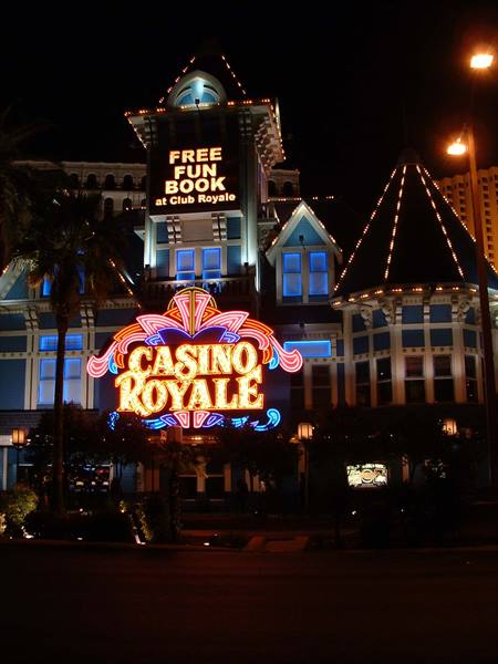 Neon signs of the Casino Royale glowing at night in Las Vegas