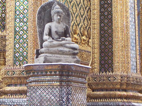 Stone seated Buddha statue on mosaic pedestal, Wat Phra Kaew