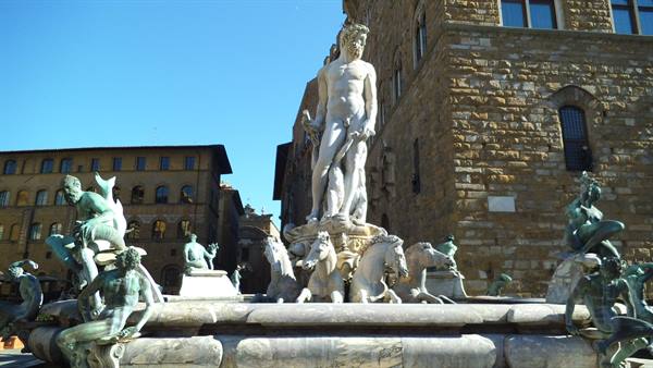Neptune marble fountain with bronze figures, Piazza della Signoria, Florence, sunny light