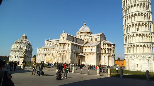 Piazza dei Miracoli in Pisa: cathedral, baptistery and leaning tower under blue sky