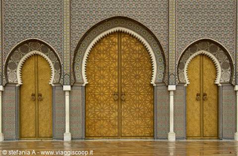 Gilded brass doors with horseshoe arches and zellij mosaic tiles, Casablanca