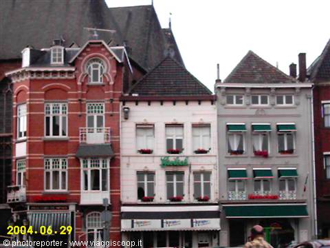 Red brick and white stucco facades with pointed roofs, Maastricht