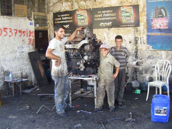 the pride of very young apprentice mechanics