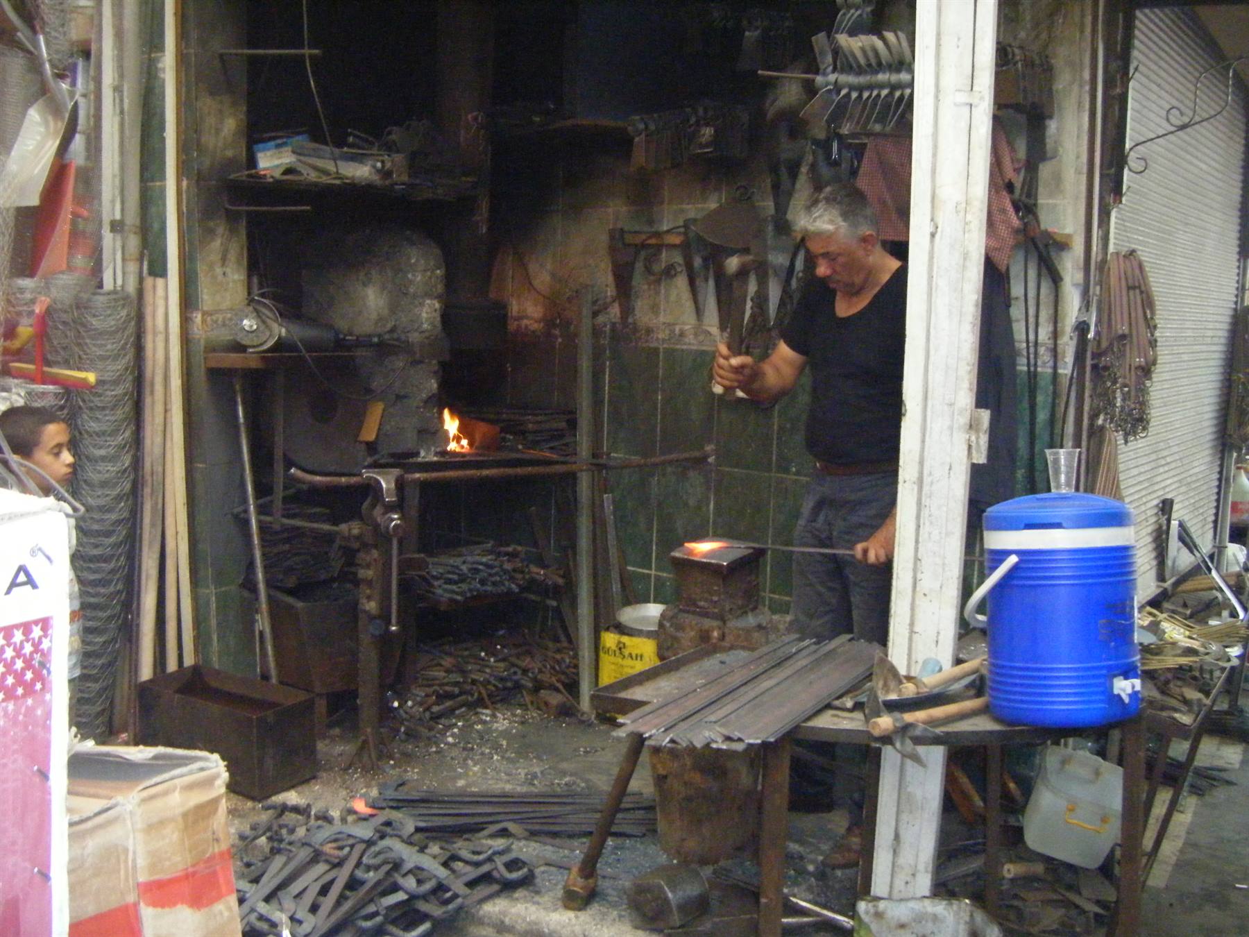 blacksmith at work... in the middle of the bazaar