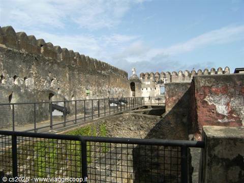Battlements and old cannons of Fort Jesus, Mombasa, under blue sky