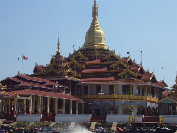 Phaung Daw Oo Pagoda on Inle Lake, golden stupa above wooden halls