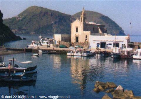 Boat in front of the Purgatory church at Lipari harbor