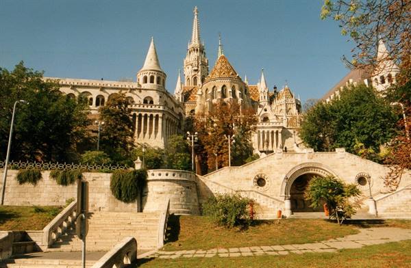 Fisherman's Bastion in Budapest, neo-Gothic stone towers among autumn trees