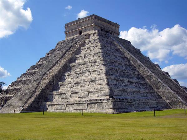 El Castillo pyramid at Chichén Itzá, limestone steps under white clouds