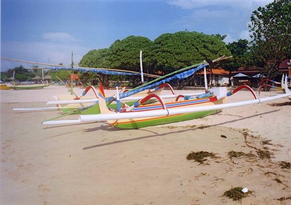 Colorful traditional Balinese jukung outrigger boat on Sanur sand