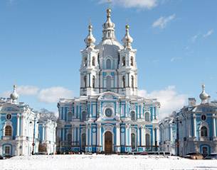 Smolny Cathedral in Saint Petersburg, white and blue baroque facade under snow