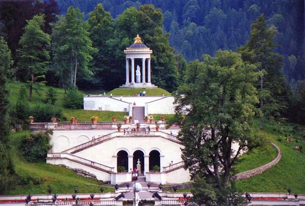 Linderhof castle park, white round temple on the hill above terraced stairways