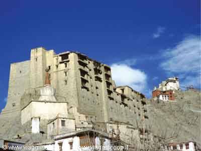 Leh Palace, ancient mud-brick fortress on rocky hill, clear blue sky