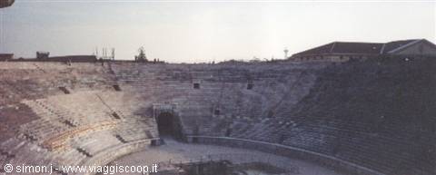 Verona Arena, stone tiers and seating under a pale sky