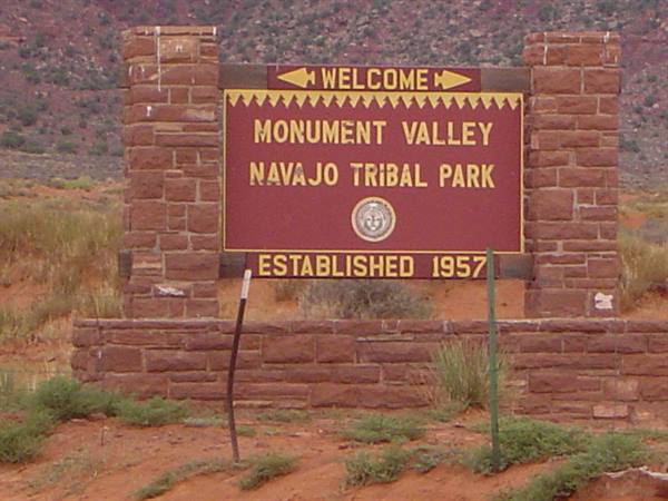Red brick welcome sign at Monument Valley Navajo Tribal Park