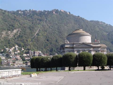Neoclassical Tempio Voltiano on Como's lakeside promenade, green hills behind