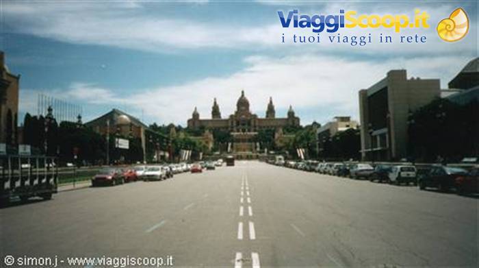 The Mnac palace on Montjuïc seen from the avenue, parked cars and cloudy sky