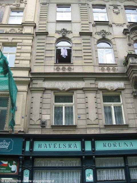 Art Nouveau facade on Havelská street in Prague, curtained windows and hanging laundry