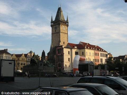 Old Town Hall clock tower rising over Prague's square