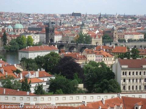 Red rooftops and Charles Bridge over the Vltava in Prague