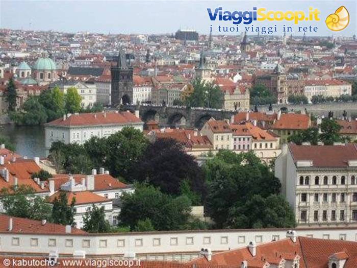 Red rooftops and Charles Bridge over the Vltava in Prague